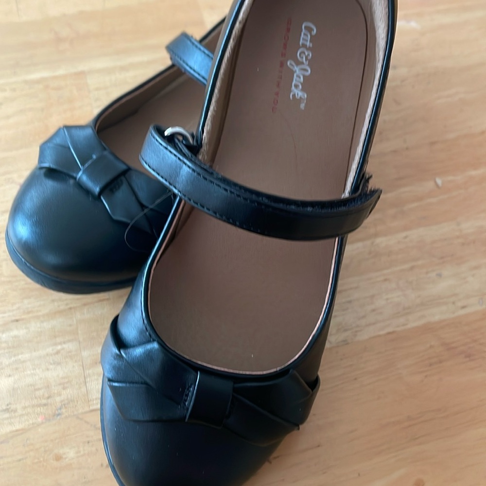 Black dress shoes has small scuff on shoe. See picture